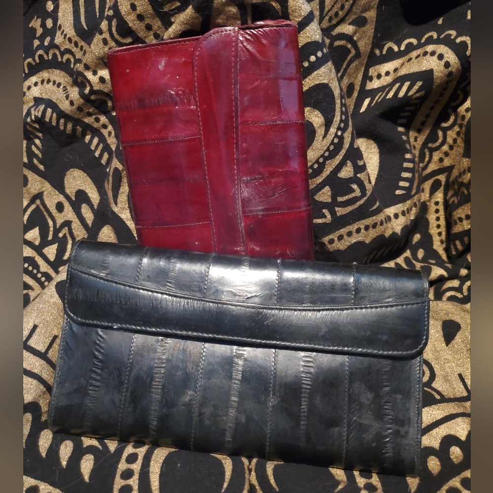 NWOT Red or Black wallets with lots of room for cards and zippered pockets